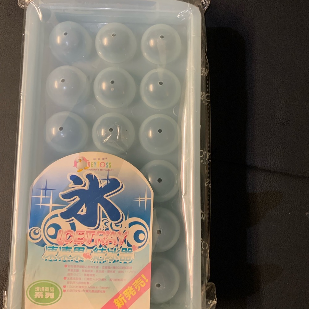 Two brand new circle ice cube trays